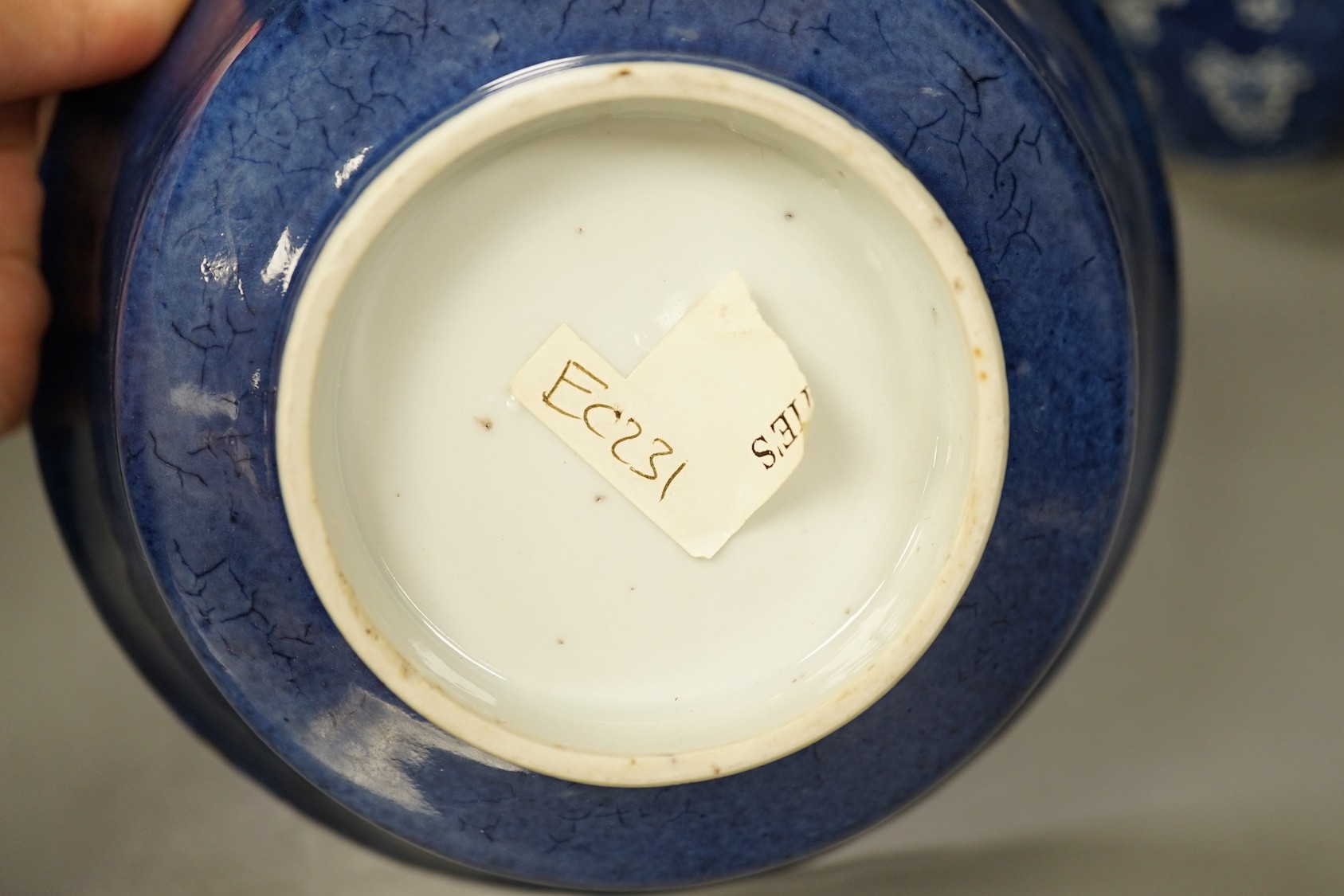 A Chinese powder blue bowl, early 18th century and a Chinese blue and white prunus jar - tallest 13cm